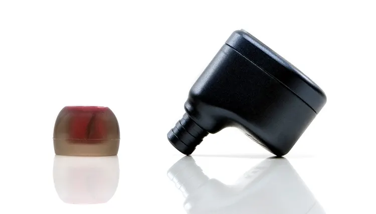 FIR Audio E12 beside a red silicone ear tip
